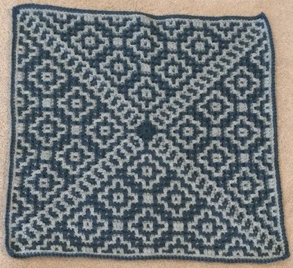 Crocheted mosaic pillow cover in two shades of blue